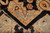 Folded corner showing pile depth, ivory fringe and hand-knotted organic wool construction