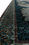Side angle along the border showing gold arabesque scrollwork against deep teal and black silk