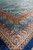 Corner of the 6 x 9 silk rug showing dome lattice meeting the multi band border