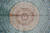 Central dome medallion in gold and ivory radiating lattice cells across the turquoise silk field
