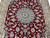 Overhead framing of medallion, red field and ivory borders on this 6'5" x 10' rug