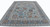 Angled floor view of large light blue Oushak area rug with slate gray main border