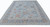 Living room scale perspective of 10'1" x 14' hand-knotted Indian Oushak rug in blue and rust