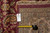 Back of the rug with tag F-4410 and tape measure confirming hand-knotted cotton weave