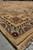 Thick wool pile at the corner, ivory fringe and pink border with green leaf motifs