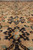 Macro of the wool pile showing black, orange and pistachio green floral detail