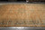 11'2 x 16'5 Persian Tabriz design rug showing symmetrical all-over floral field and wide border