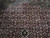 Herati fish pattern field detail in rust and rose with stepped medallion edge and pendant