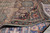 Folded corner revealing the finely woven back and cotton foundation of this 1960s Persian rug