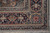Corner detail with ivory cartouche palmettes, navy ground and pale blue outer guard stripe