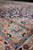 Peach main border close-up with navy flowerheads, orange rosettes and soft tonal fold shading