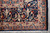Corner detail showing navy scroll border, layered guard stripes and clean ivory cotton fringe