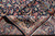 Folded back corner exposing the tight weave, knot density and cotton foundation of the rug