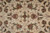 Floral motif detail with burgundy rosettes, sage leaves and pink blossoms on cream wool