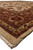 Low angle of the hand-knotted India rug corner showing pile depth and selvage
