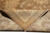 Folded corner revealing tight cotton foundation, even knotting and dense natural wool pile on the reverse