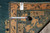 Tape measure and dealer tag documenting size and weave of this antique Chinese Peking rug