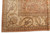 Border corner showing ivory main band, scrolling vines and rust outer edge resolution