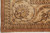 Corner detail with curled lotus palmette and paisley boteh guard border in tan tones