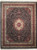 Black wool and silk Oriental rug with ivory medallion, burgundy floral borders and cream fringe