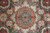 Detail of the central star medallion surrounded by tile compartments in green, red and gold