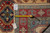 Tape measure and inventory tag confirming the 65 inch width of this hand-knotted wool runner