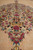 Detail along the medallion pendant showing gold chrysanthemums, burgundy roses and fine brown outlines
