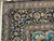 Corner detail of hand-knotted wool Kashan showing light blue guard stripe, palmette border and ivory fringe