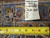 Back of rug with tape measure and hand woven tag listing rug number 6286, size 9.10 x 12.11