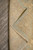 8' x 10'6" hand-knotted rug folded back to reveal cotton foundation and even quarter inch pile