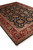 Corner perspective of a large 9x12 Oriental rug with ivory fringe and layered borders