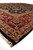 Low angle along the rug edge showing pile depth, black selvage and fringe