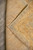 Folded corner revealing the cotton foundation and even knot rows on the rug reverse
