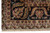 Detail of black border corner with pink palmette, tan guard band and ivory fringe
