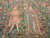 Close-up of two kings holding staffs and armorial banners, one robed in ermine and pink