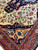 Detail of ivory field meeting navy corner spandrel and gold panel with blue palmettes