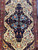 Indigo medallion with sky blue rosettes framed by ivory spandrels of delicate floral sprays