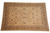 Camel border and ivory field seen across the full length of this large Chobi rug