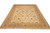 Angled full view of hand-knotted wheat beige Peshawar wool rug on white studio background