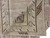 Folded corner detail revealing cloudband border, brown geometric bracket and hand-knotted wool pile