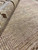6x9 Turkish rug weave macro showing dense even wool knots in warm neutral beige