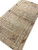 Angled view showing sage green abrash band and brown medallion outlines across low pile wool
