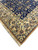 Ivory selvage and hand-tied fringe at the corner of this hand-knotted Persian Nain accent rug