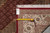 Back tag marked F-4474 with tape measure confirming 8 x 9.10 size and reverse weave