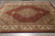 8 x 10 wool and silk Mahi rug photographed on grey tile floor showing full herati design