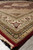 8'2 x 10 Mahi design rug photographed low along its border with fringe visible