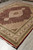 8x10 wool and silk rug seen from the side showing ivory spandrels and multiple borders