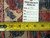 Reverse of the rug with inventory tag 6196 and tape measure over the cotton foundation