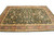 Large 9'9" x 14' hand-knotted wool rug viewed from the side, plum and gold borders