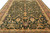 Close overhead of green field with large golden palmettes, lavender rosettes and scrolling vinework